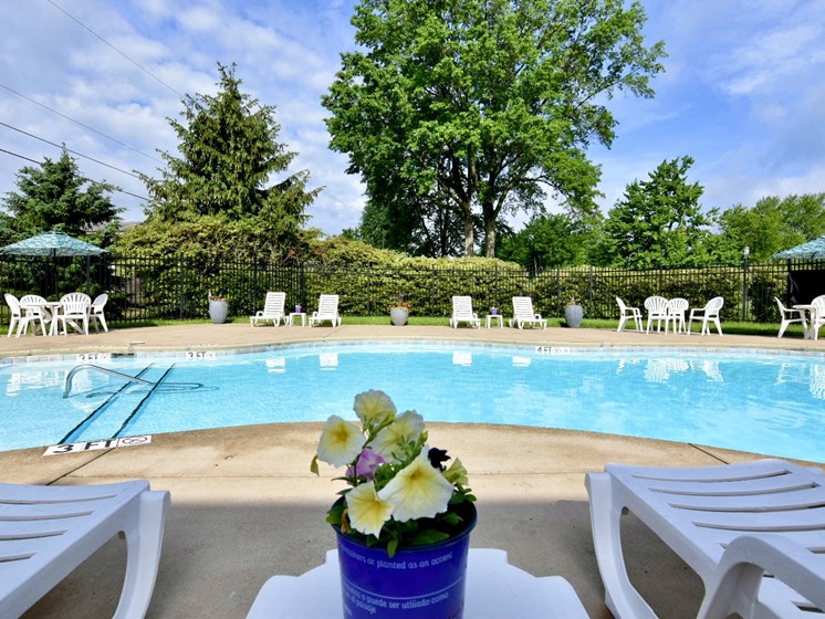 Pool with Lounge Chairs at River Run Apartments in Warren, OH, Integrity Realty LLC